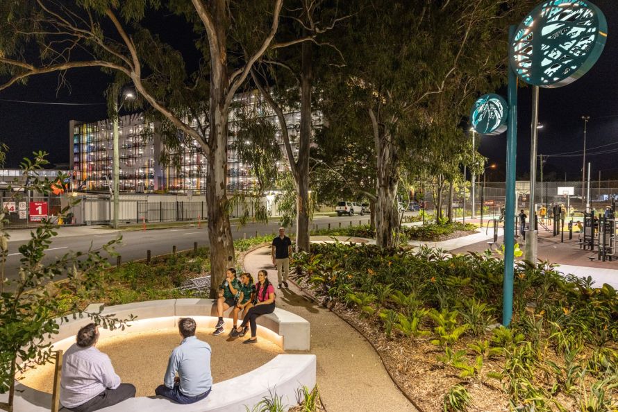 Night time view of people using the Logan City Council Armstrong Place East area.