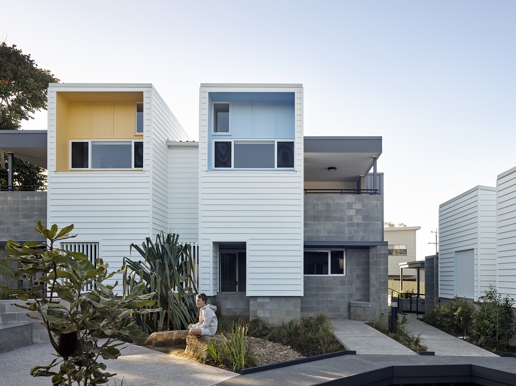 View from the central, landscaped courtyard to the balconies of the 2 upper-level homes.